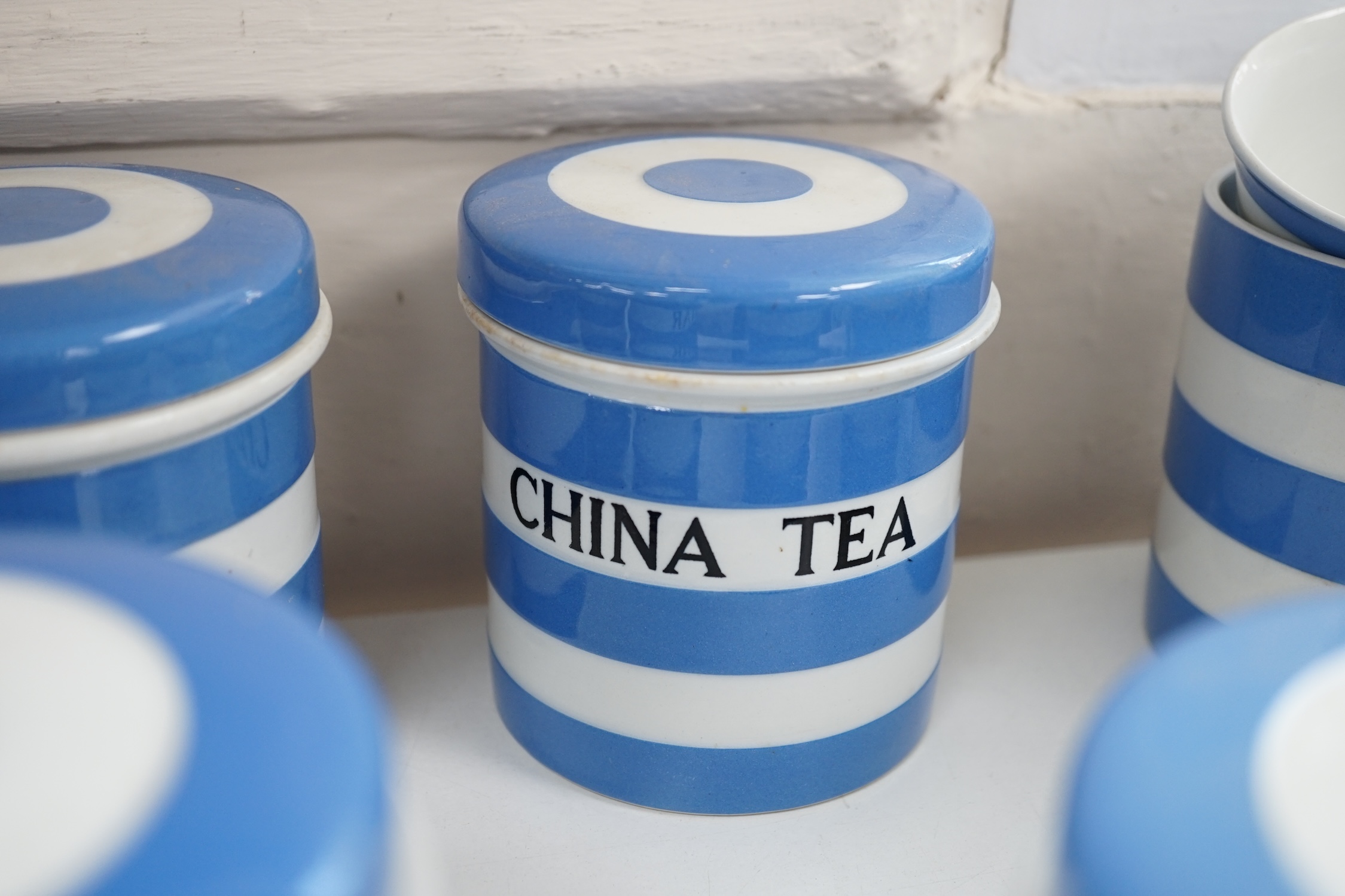 T.G.Green Cornish Kitchenware, nine 10.5cm lidded storage jars to include China Tea, Pearl Barley, Spice, Currants and Ground Almonds, mainly Black Shield marks. Condition - fair to good